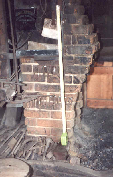Corbeling of chimney extends slightly over fire