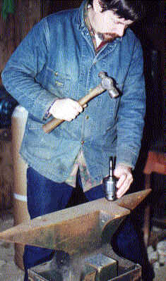Hammering the chuck arbor into the chuck.