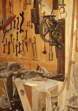 CLICK HERE - small post drill in farmers shop display - Old Thresher's museum at Mt. Pleasant Iowa