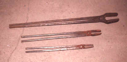 Various sizes of  homemade tongs from large to small.